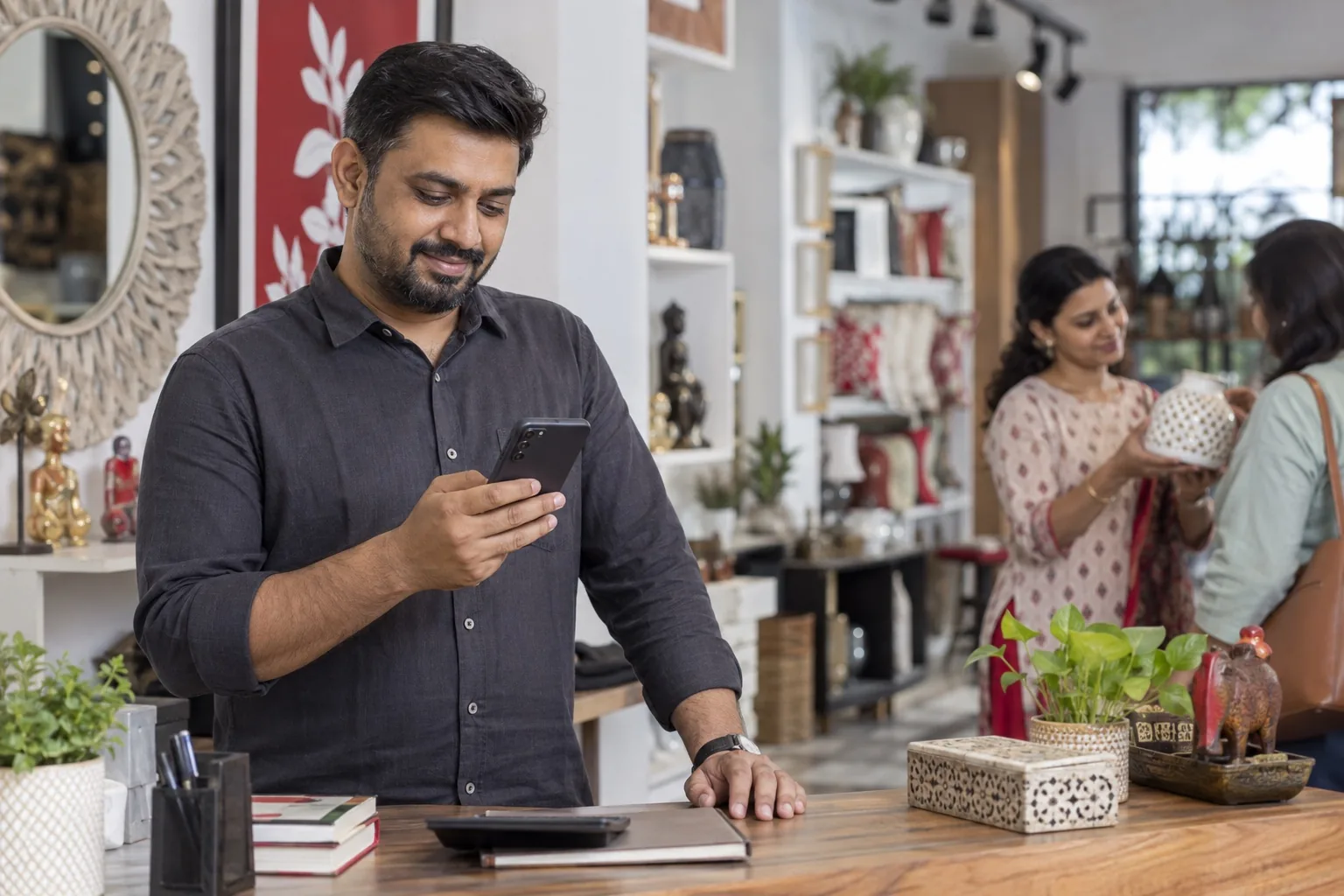 Illustrative shop owner checking customer conversations on a phone